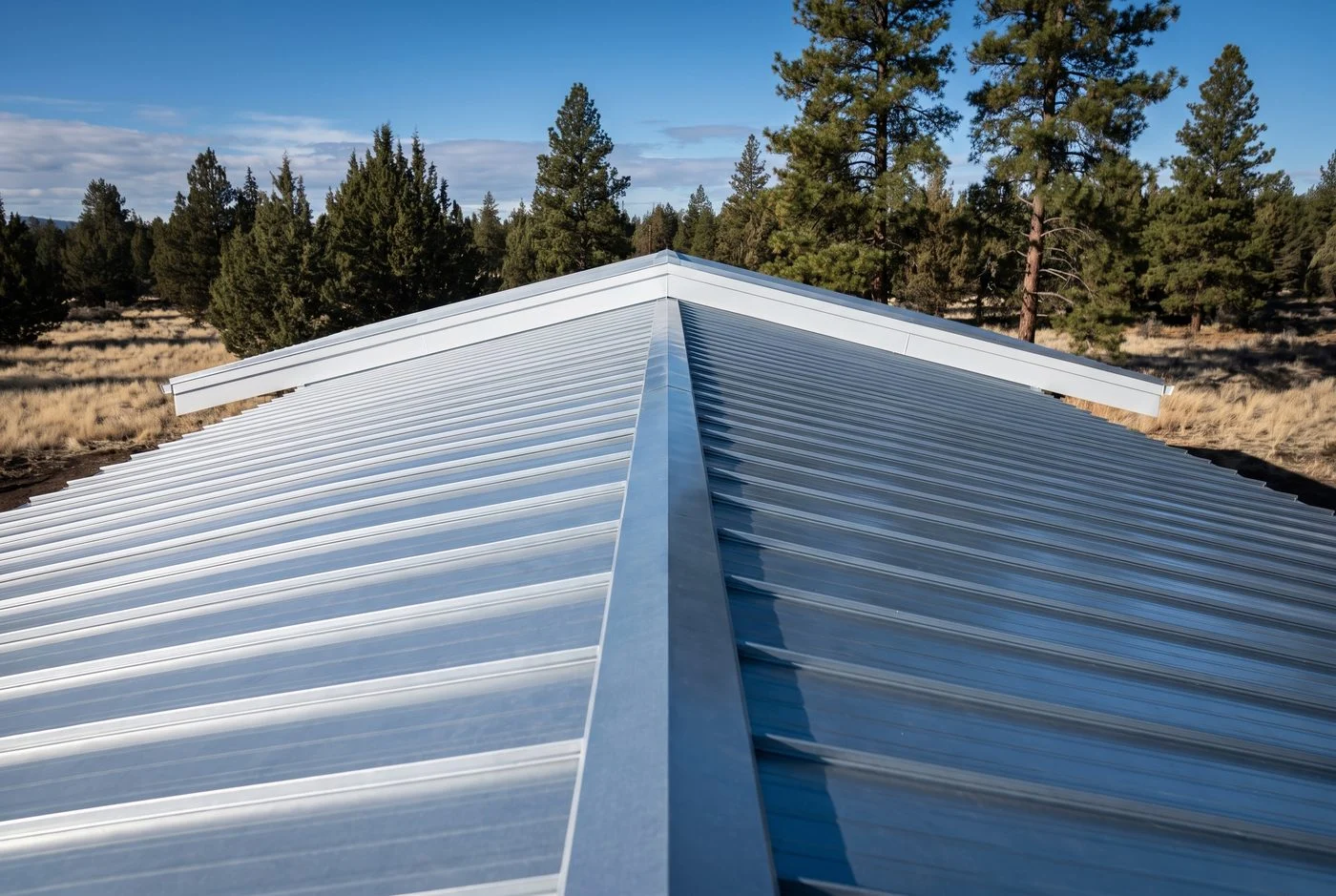 Looking along a new standing-seam metal roof from the ridge